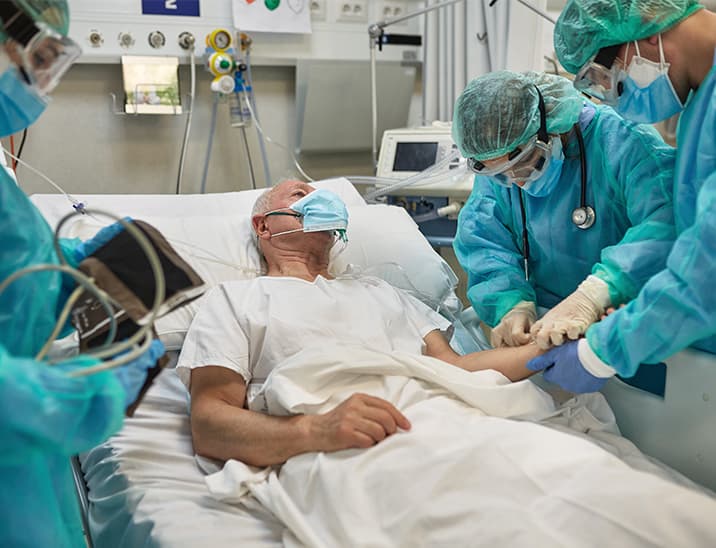 Man in hospital bed getting IV thumbnail pic